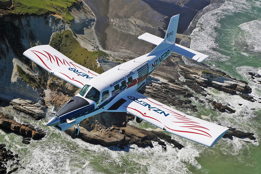 NZAero plane flying over the coast