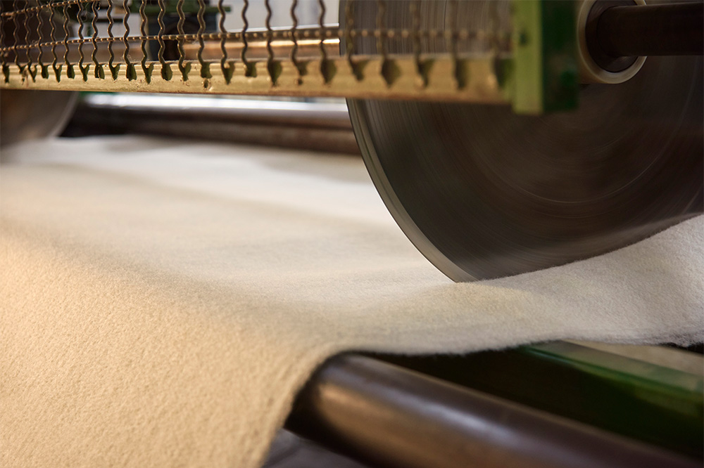 Our cutting machine at work, shaping Wisewool Blanketing - 100% natural, 100% New Zealand-made.