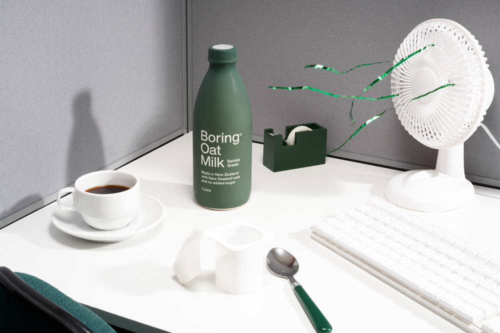 Boring Oat Milk on a office desk